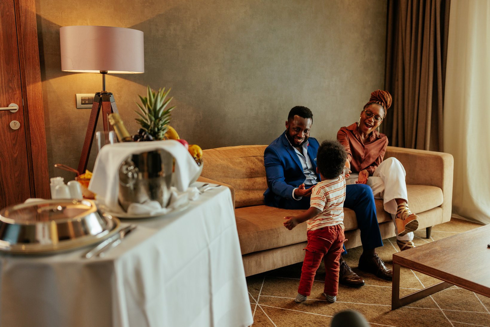 Wealthy family on vacation in hotel.
